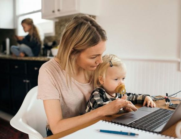 Mother and daughter using laptop computer