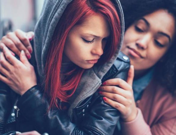 girl caring for depressed friend