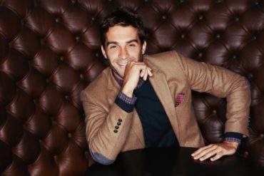 young man sitting on couch