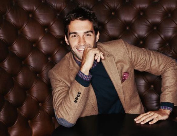 young man sitting on couch