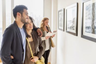 Couple admiring art in gallery