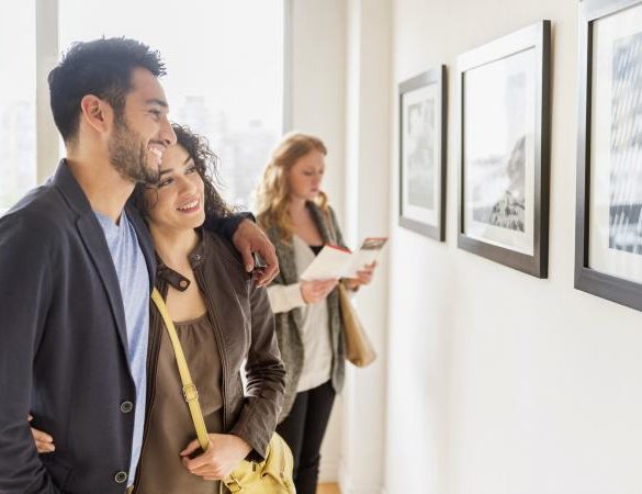 Couple admiring art in gallery