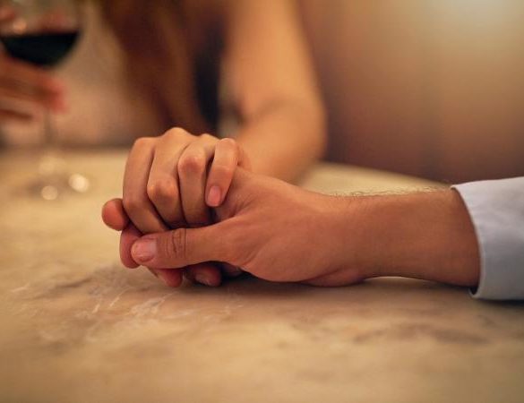 Image of Virgo man and partner holding hands