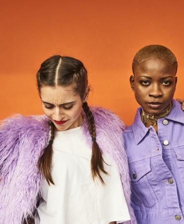 Two friends dressed in purple