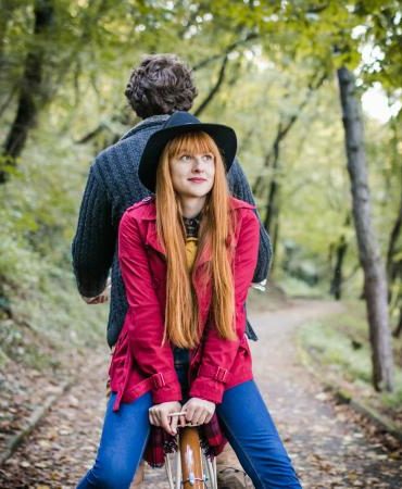 Couple enjoying ride on bicycle