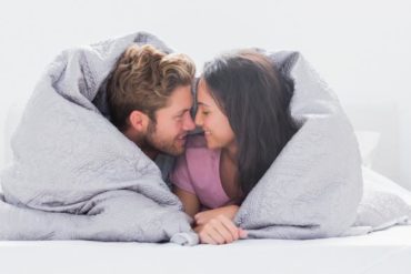 Couple wrapped in blanket