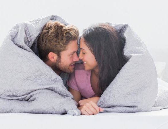 Couple wrapped in blanket