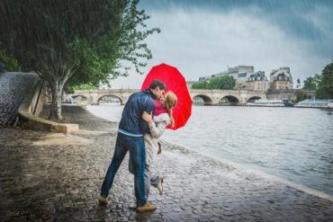 Couple kissing under the rain