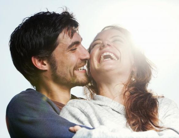 Young couple hugging and laughing together