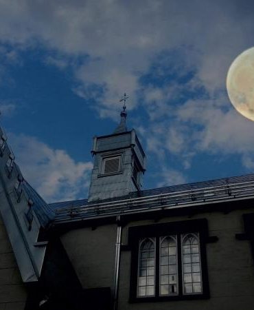 full moon over building