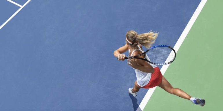 competitive woman playing tennis