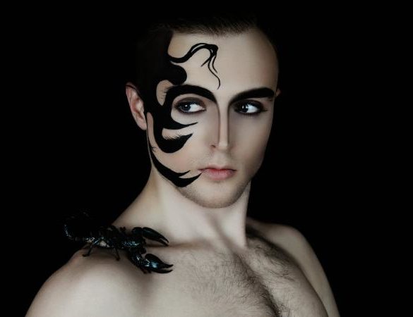 Man with dramatic face tattoo