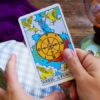 Holding wheel of fortune tarot card
