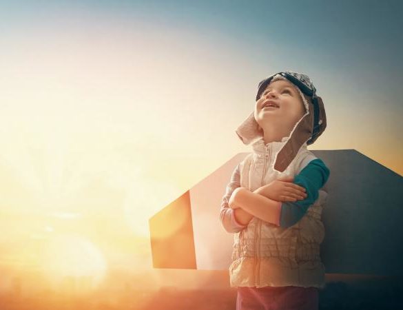 Kid in an astronaut costume dreaming of becoming a spaceman