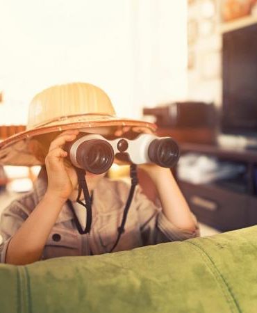 little boy exploring living room