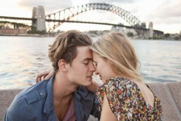 Couple embracing near Sydney Harbour Bridge