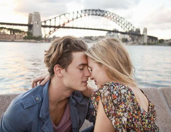 Couple embracing near Sydney Harbour Bridge