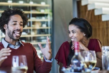 Man telling a story at a dinner party