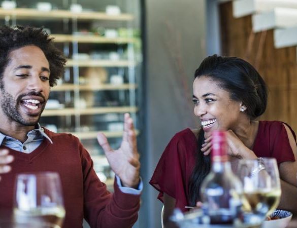 Man telling a story at a dinner party