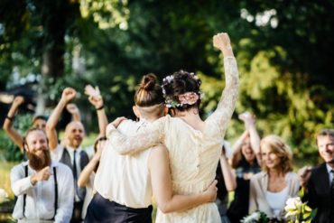 Newlywed brides excited at end of ceremony