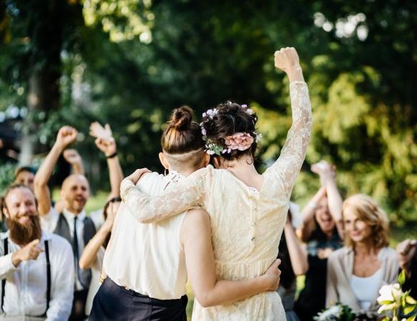 Newlywed brides excited at end of ceremony