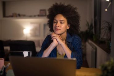 young woman using laptop