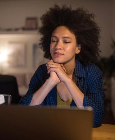 young woman using laptop