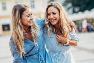 Happy twins in the city