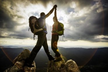 Couple on top of a mountain