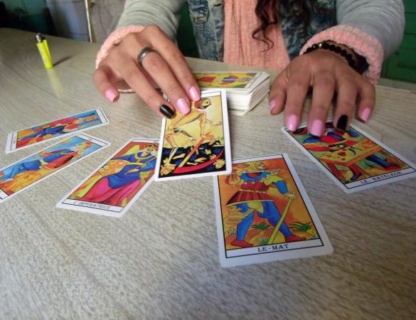 woman with tarot spread
