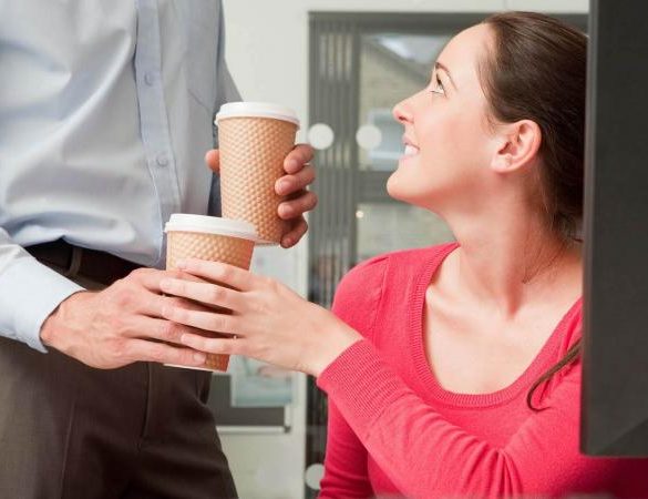 Male bringing female coffee