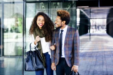 Well-dressed couple smiling