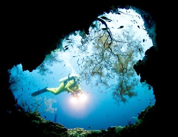 Deep sea diver in a cave
